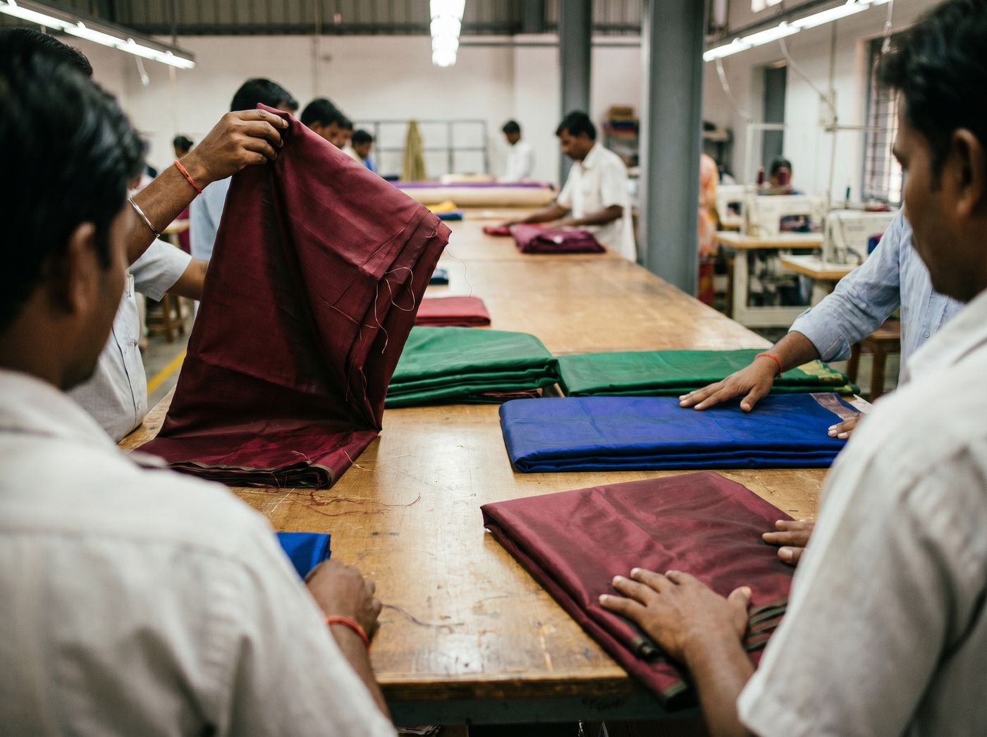 Womantra team preparing fabrics and collections
